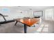 Game room featuring a ping pong table, treadmill and entertainment area, perfect for recreation and fitness at 10231 Beechwood Ln, Orlando, FL 32832
