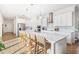 Bright, open kitchen features a large island, stainless appliances, and pendant lighting at 10231 Beechwood Ln, Orlando, FL 32832