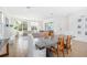 Bright open-concept living room with modern furnishings and large windows overlooking the front yard at 10231 Beechwood Ln, Orlando, FL 32832