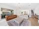 Open living room features tile floors, sliding glass doors to patio and easy access to kitchen at 10231 Beechwood Ln, Orlando, FL 32832