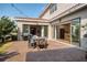 Inviting outdoor patio with a grill, dining area, and convenient access to the home's kitchen and interior at 10231 Beechwood Ln, Orlando, FL 32832