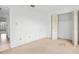 Cozy bedroom features a closet and plush neutral carpeting, with a bright window at 10305 Licorice Way, Orlando, FL 32821