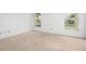 Spacious bedroom with neutral carpet and bright windows, perfect for relaxation at 10305 Licorice Way, Orlando, FL 32821