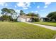 Well-kept single-Gathering home with a green lawn, a driveway, and a one-car garage at 10305 Licorice Way, Orlando, FL 32821