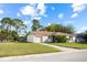 Charming single-story home with a well-maintained lawn and attached garage at 10305 Licorice Way, Orlando, FL 32821