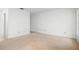 Spacious living room with neutral carpet, ideal for creating your dream entertaining space at 10305 Licorice Way, Orlando, FL 32821