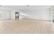 Open-concept living area with neutral tile, connecting to the kitchen area for easy entertaining at 10305 Licorice Way, Orlando, FL 32821