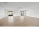 Expansive living room featuring tile flooring and sliding glass doors providing access to the outdoors at 10305 Licorice Way, Orlando, FL 32821