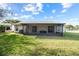 Cozy patio with screen and sliding door access, perfect for outdoor entertaining at 10305 Licorice Way, Orlando, FL 32821