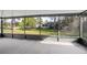 Enclosed porch with a view of the backyard and green landscape at 10305 Licorice Way, Orlando, FL 32821