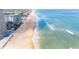 Aerial view of condos, beach, ocean and surf at 111 S Atlantic Ave # 301, Ormond Beach, FL 32176