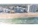 Aerial view of condo buildings lining the beach with ocean views at 111 S Atlantic Ave # 301, Ormond Beach, FL 32176