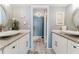 Spacious bathroom with double sinks, granite countertops, and modern decor at 111 S Atlantic Ave # 301, Ormond Beach, FL 32176