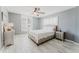 Comfortable bedroom with neutral tones, ceiling fan and large windows at 111 S Atlantic Ave # 301, Ormond Beach, FL 32176