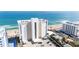 Stunning beachfront condo building with a pristine white exterior, offering breathtaking ocean views and convenient parking at 111 S Atlantic Ave # 301, Ormond Beach, FL 32176