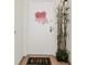 A cheerful white front door is decorated with a red and white bow and potted bamboo at 111 S Atlantic Ave # 301, Ormond Beach, FL 32176