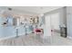 Eat in kitchen features a breakfast bar with seating and dining table at 111 S Atlantic Ave # 301, Ormond Beach, FL 32176