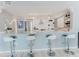 Open kitchen with granite counters, stainless appliances, and bar seating at 111 S Atlantic Ave # 301, Ormond Beach, FL 32176