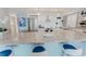 Kitchen featuring granite counters, stainless appliances, and bar seating at 111 S Atlantic Ave # 301, Ormond Beach, FL 32176