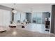Living room with modern decor, water view and access to balcony at 111 S Atlantic Ave # 301, Ormond Beach, FL 32176