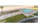Elevated view of pool, patio, and ocean at 111 S Atlantic Ave # 301, Ormond Beach, FL 32176