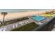 View from balcony of community pool, beach and ocean at 111 S Atlantic Ave # 301, Ormond Beach, FL 32176