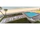 A picturesque pool and lounge area overlooks a beautiful sandy beach, offering a perfect blend of relaxation and coastal living at 111 S Atlantic Ave # 301, Ormond Beach, FL 32176
