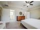 Bedroom boasts a ceiling fan, ensuite bathroom, a walk-in closet, and modern decor at 1217 E Muriel St, Orlando, FL 32806