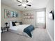 This bedroom features light walls, carpet, a ceiling fan and great natural light at 1217 E Muriel St, Orlando, FL 32806