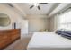Spacious bedroom featuring tray ceiling, ceiling fan, a walk-in closet, and a lot of natural light at 1217 E Muriel St, Orlando, FL 32806