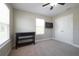 A light-filled bedroom with carpeting, neutral paint, and a window at 1217 E Muriel St, Orlando, FL 32806
