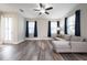 Modern living room featuring a ceiling fan, hardwood floors, and modern furniture at 1217 E Muriel St, Orlando, FL 32806