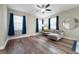 Living room featuring a ceiling fan, hardwood floors, and modern furniture at 1217 E Muriel St, Orlando, FL 32806
