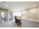 Loft office space with a built-in desk, chair and access to a laundry area and bedroom at 1217 E Muriel St, Orlando, FL 32806