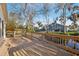 A spacious backyard view from the deck featuring lawn and view of a creek at 124 Loon Ct, Daytona Beach, FL 32119