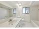 Bathroom featuring a shower and tub combination, and a vanity with mirror at 124 Loon Ct, Daytona Beach, FL 32119