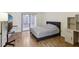 A comfortably sized bedroom is furnished with an oversized bed and an abundance of natural light at 124 Loon Ct, Daytona Beach, FL 32119