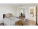 Comfortable bedroom with luxury vinyl plank flooring and sliding mirror closet doors at 124 Loon Ct, Daytona Beach, FL 32119