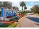 View of community entrance sign showcasing well-maintained landscaping and clear signage at 124 Loon Ct, Daytona Beach, FL 32119