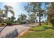View of community entrance featuring a guard house and neatly kept grounds at 124 Loon Ct, Daytona Beach, FL 32119