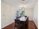 Formal dining room featuring hardwood floors and a stylish chandelier at 124 Loon Ct, Daytona Beach, FL 32119