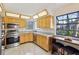 Kitchen featuring stainless steel appliances, light wood cabinets, and a breakfast bar at 124 Loon Ct, Daytona Beach, FL 32119