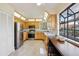 Bright kitchen features stainless steel appliances and a breakfast bar overlooking a window at 124 Loon Ct, Daytona Beach, FL 32119
