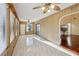This spacious living area boasts wood paneling, bright windows and sliding glass door access to the exterior at 124 Loon Ct, Daytona Beach, FL 32119