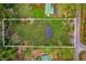 Aerial view showing home's location on the lot at 1356 Cupid Ave, Christmas, FL 32709