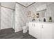 Clean bathroom with white vanity, shower, and grey flooring at 1356 Cupid Ave, Christmas, FL 32709