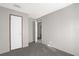 Simple bedroom with carpet flooring and an open door at 1356 Cupid Ave, Christmas, FL 32709