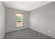 Simple bedroom with a window, carpet, and neutral walls at 1356 Cupid Ave, Christmas, FL 32709