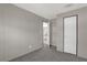 Simple bedroom with a door leading to another room at 1356 Cupid Ave, Christmas, FL 32709