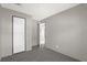 Cozy bedroom with grey carpet and an open door at 1356 Cupid Ave, Christmas, FL 32709